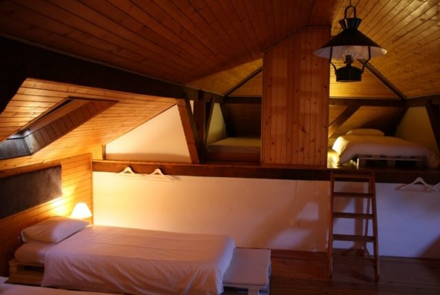 Attic room beds surf house