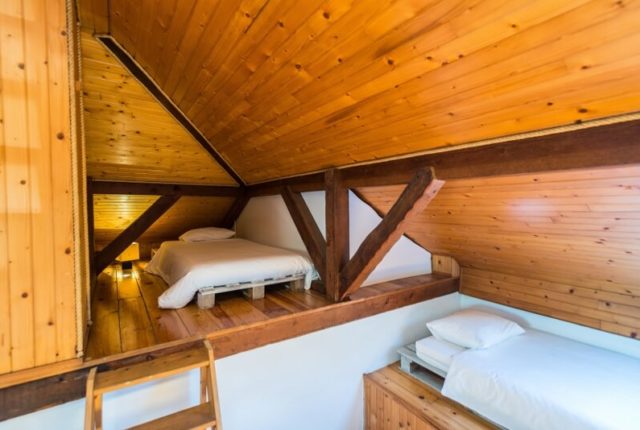 Attic room beds surf house