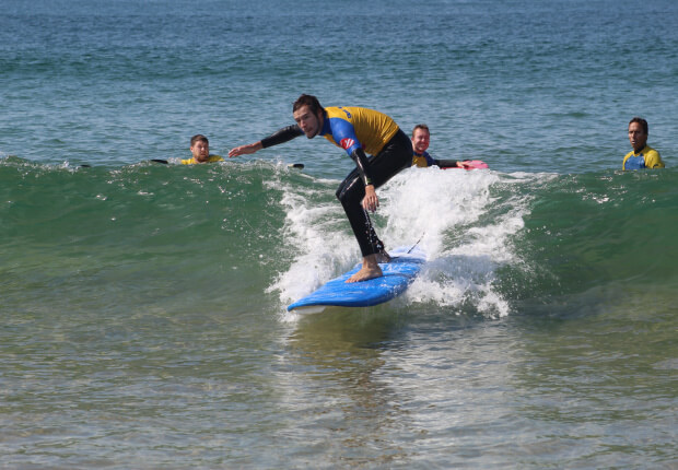 Erasmus student learning how to surf