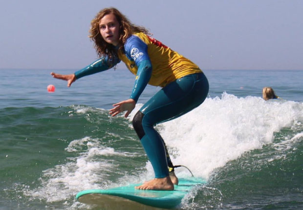 Girl learning to surf
